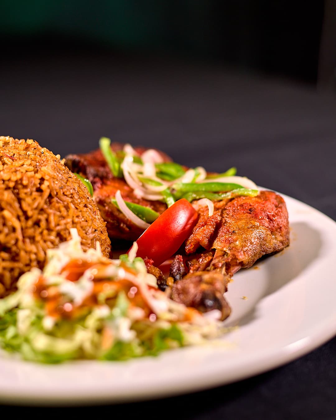 Jollof rice with grilled chicken at Delish Restaurant